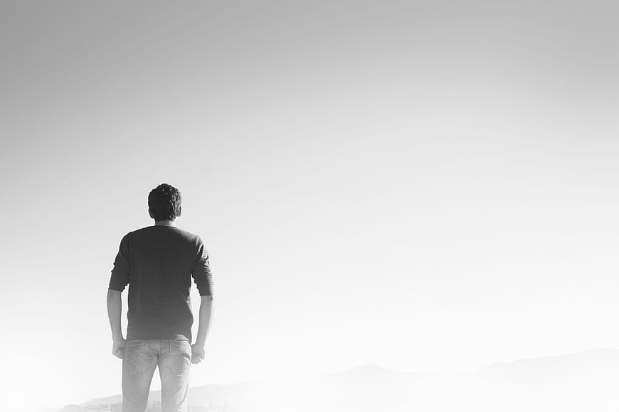 Lonely Man Standing In White Misty Landscape Black And White