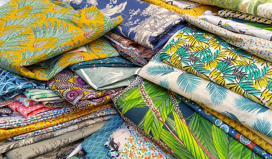 Colorful Patterned Fabric Stacks for Sewing and Textile Design