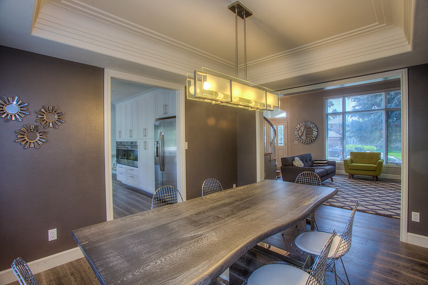 Modern dining room with live edge table and open kitchen