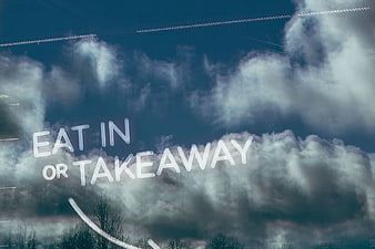 Eat In or Takeaway Text on Restaurant Window