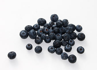 Fresh Blueberries Scattered On White Background