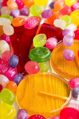Colorful jelly candies and lollipops close up