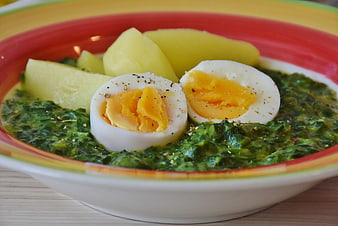Healthy spinach soup with boiled egg and potatoes