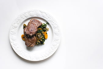 Top View of Grilled Beef Steak with Vegetables on White Plate