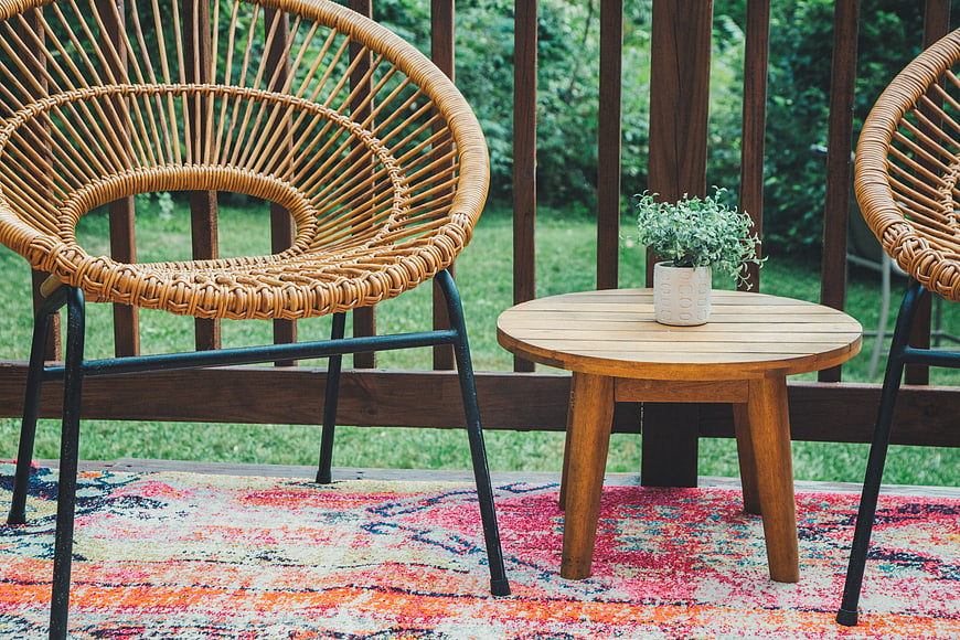 Wicker Patio Chairs and Wooden Table on Deck