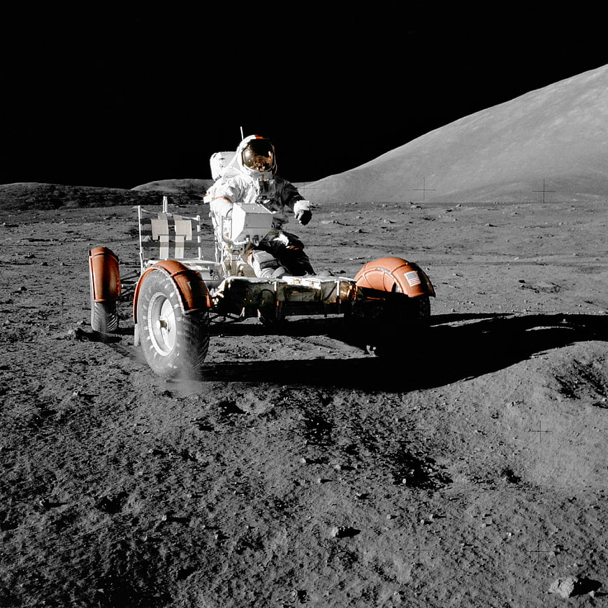 Astronaut Driving Lunar Roving Vehicle on Moon Surface
