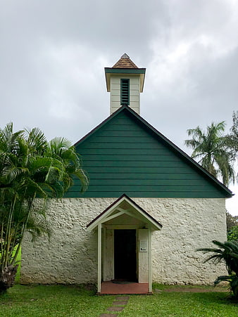 Small Green and White Chapel with Palm Trees