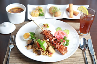 Delicious pork skewer lunch set with noodles and appetizers