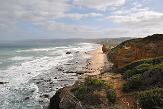 Coastal Beach View With Cliffs And Ocean Waves