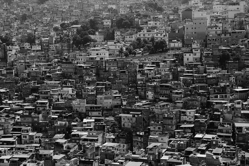 Black and white aerial view of dense hillside urban settlement