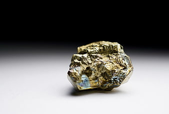 Raw Pyrite Mineral Specimen on White Background