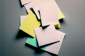 Stack of blank sticky notes on gray background
