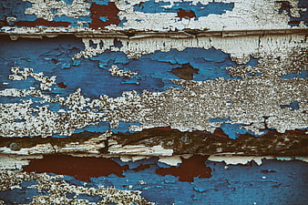 Weathered Blue and White Peeling Paint on Old Wood