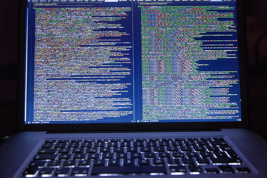 Laptop Screen Displaying Lines of Computer Source Code