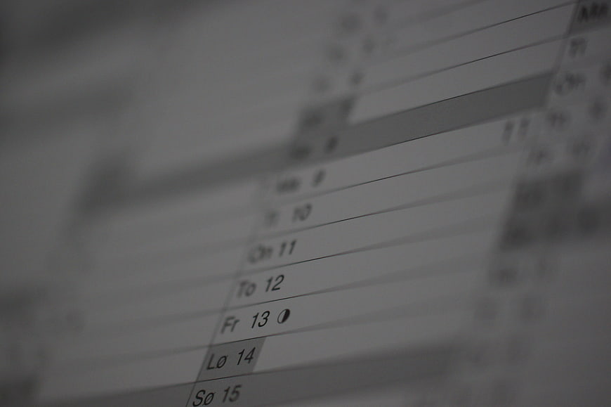 Close-up of a digital weekly calendar schedule on a computer screen