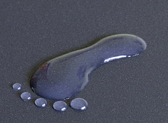 Abstract Water Droplets on Dark Textured Surface