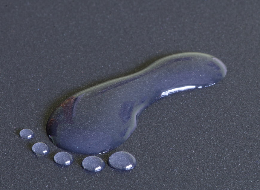 Abstract Water Droplets on Dark Textured Surface