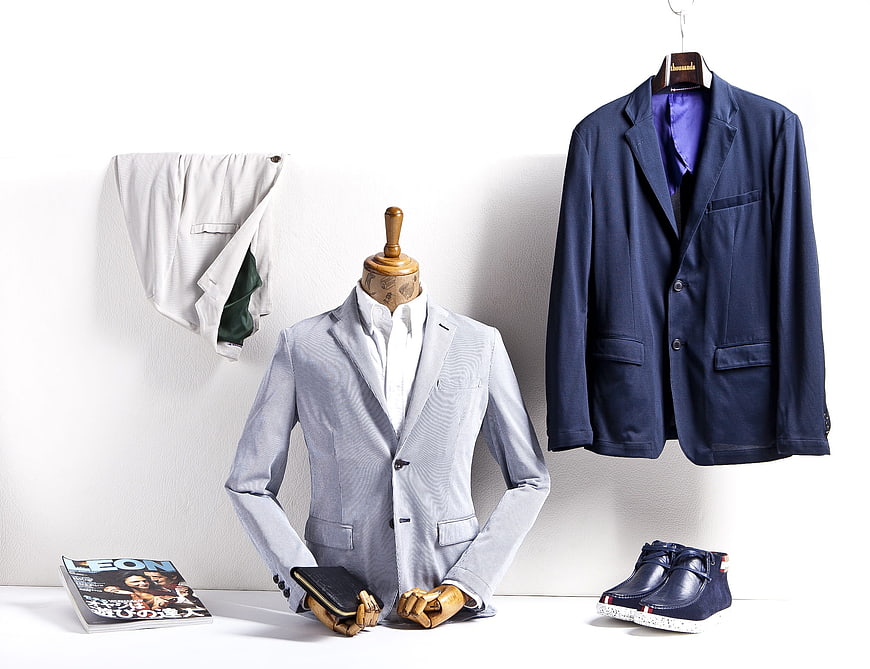 Men's Fashion Display With Light Blue Blazer, Navy Jacket, Shoes, And Magazine
