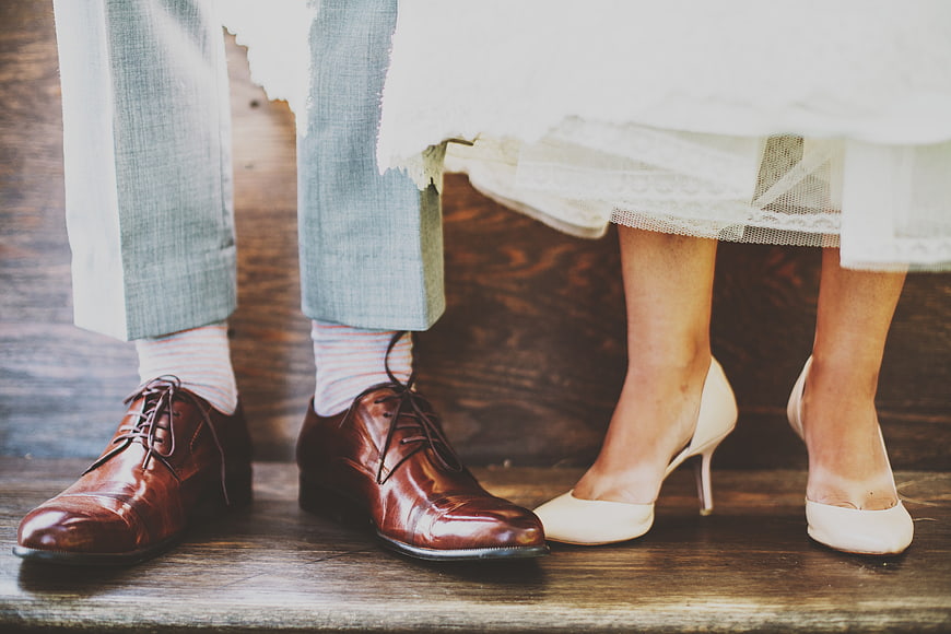 Wedding Couple Feet in Shoes and Dress Hem
