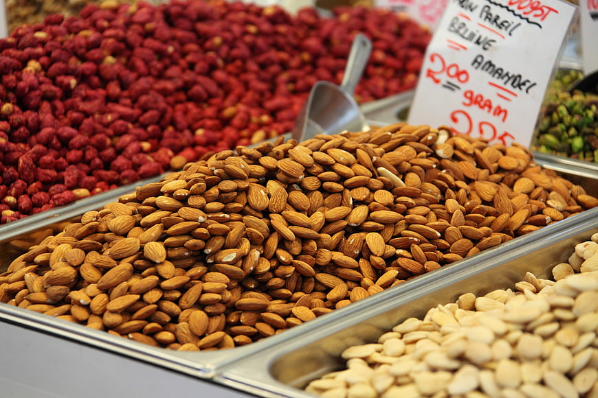 Piles of almonds and hazelnuts at a market stall
