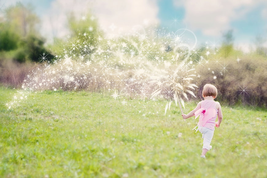 Little Girl With Dandelion Wand In Summer Meadow