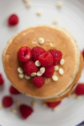 Top View of Pancakes with Raspberries and White Chocolate Chips