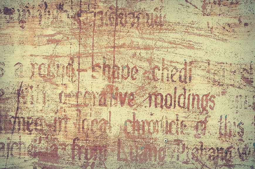 Vintage Grunge Texture with Faded Typography on Aged Surface