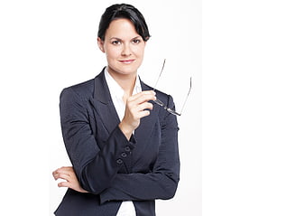 Confident Business Woman Holding Glasses in Suit