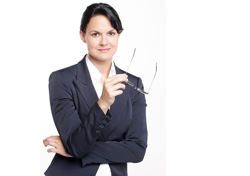 Confident Business Woman Holding Glasses in Suit