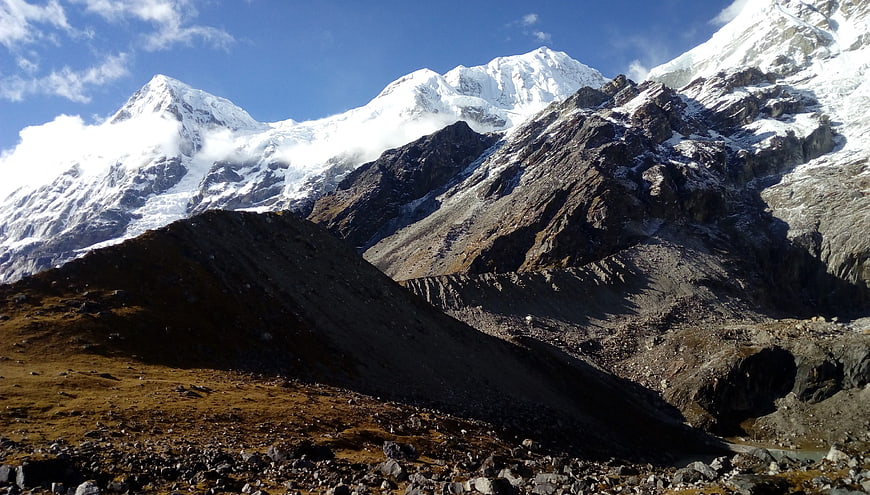 Majestic Snow-Capped Mountain Peaks with Rocky Foreground
