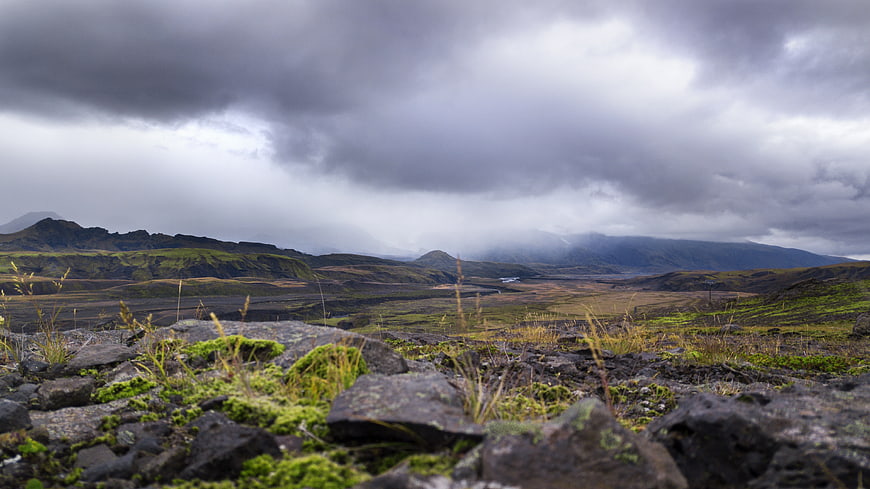 Dramatic Icelandic Landscape with Mossy Rocks and Cloudy Sky