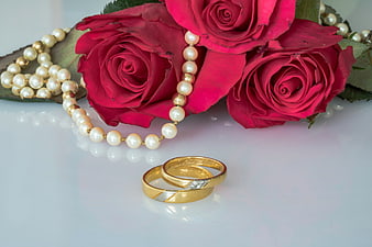 Gold Wedding Rings With Red Roses And Pearl Necklace
