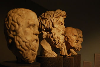 Ancient Greek marble philosopher busts in museum display