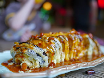 Close-up of fried eggplant dish with sauce on a plate