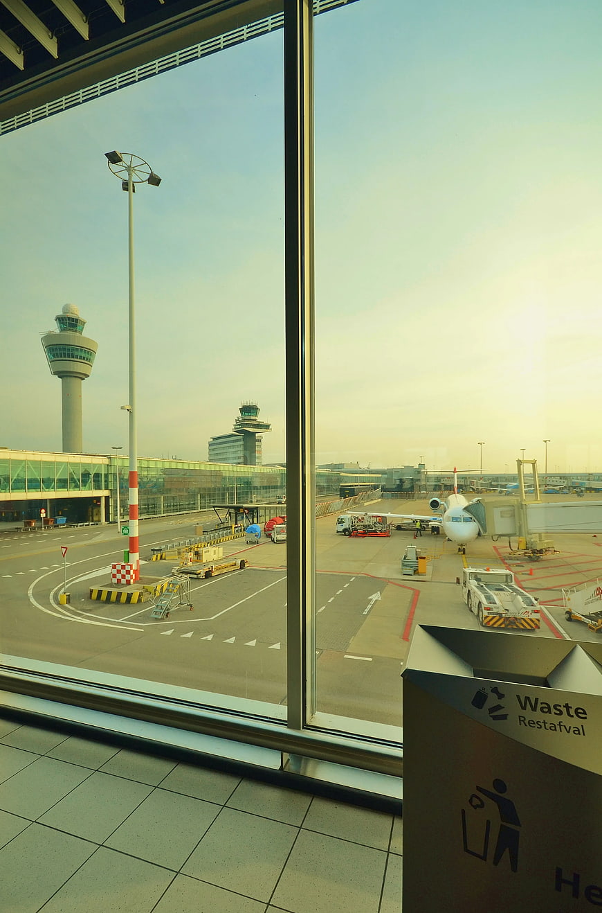 Airport Terminal View with Control Tower and Aircraft