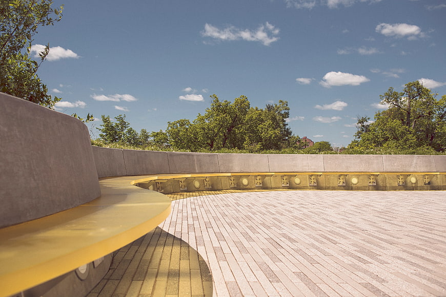 Modern curved concrete bench in outdoor plaza