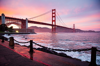 Golden Gate Bridge Sunset with Pink Sky and Ocean Waves