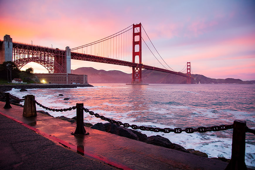 Golden Gate Bridge Sunset with Pink Sky and Ocean Waves