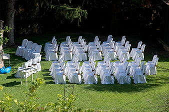 Outdoor Wedding Ceremony Seating Arrangement On Green Lawn