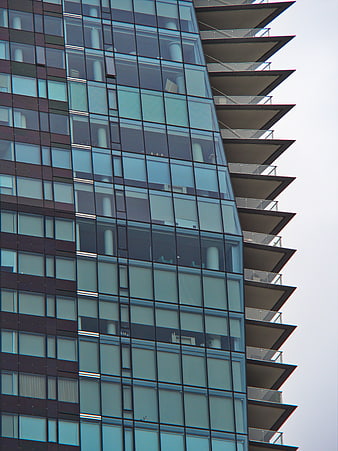 Modern Glass Skyscraper Facade with Balconies