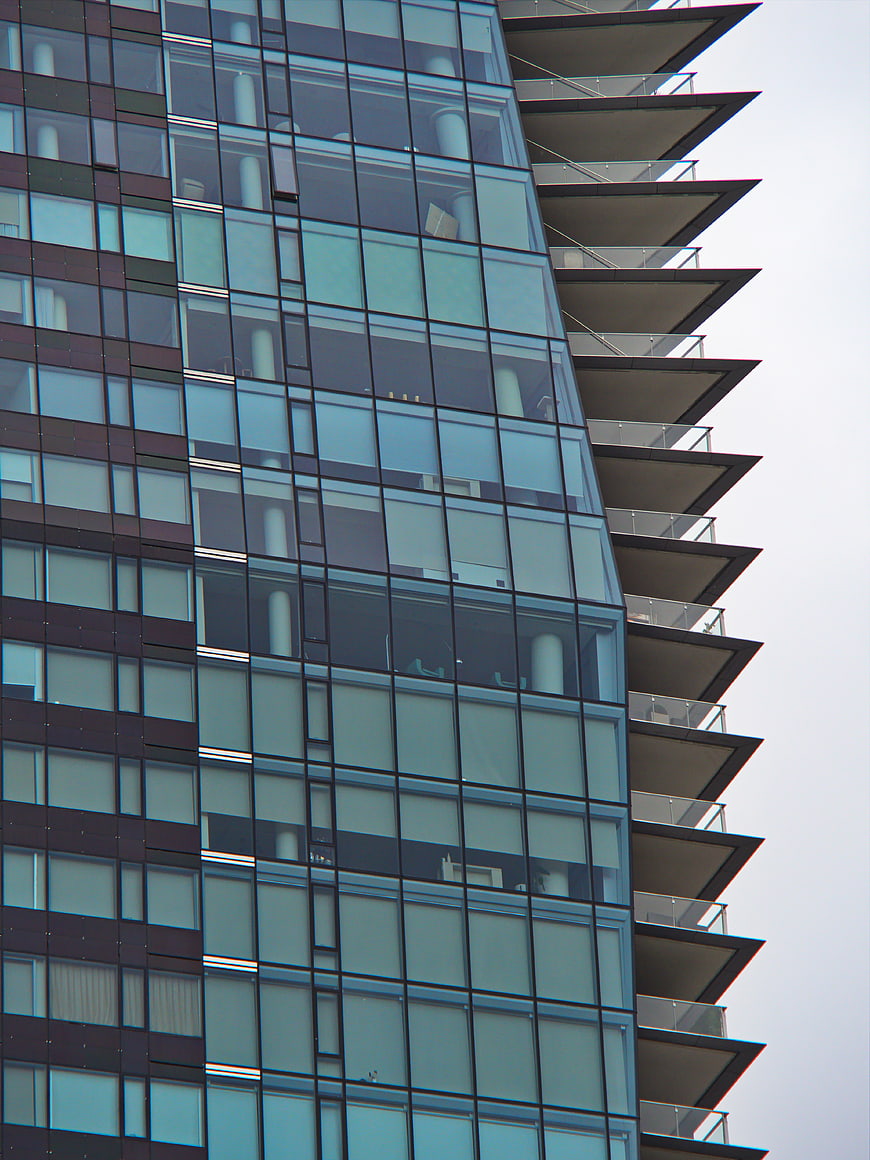 Modern Glass Skyscraper Facade with Balconies