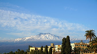 Snow-capped Mount Etna volcano view from Taormina, Sicily