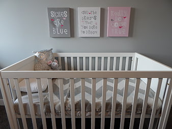 Modern White Crib in Gray Nursery with Inspirational Wall Art