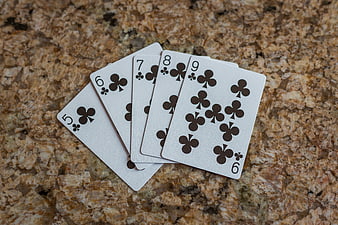 Straight Flush of Clubs on Granite Surface