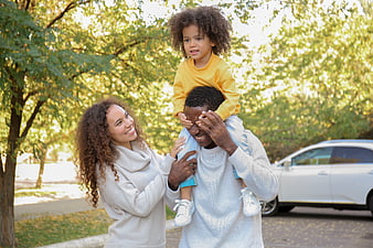 Happy African American Family Playing in Park