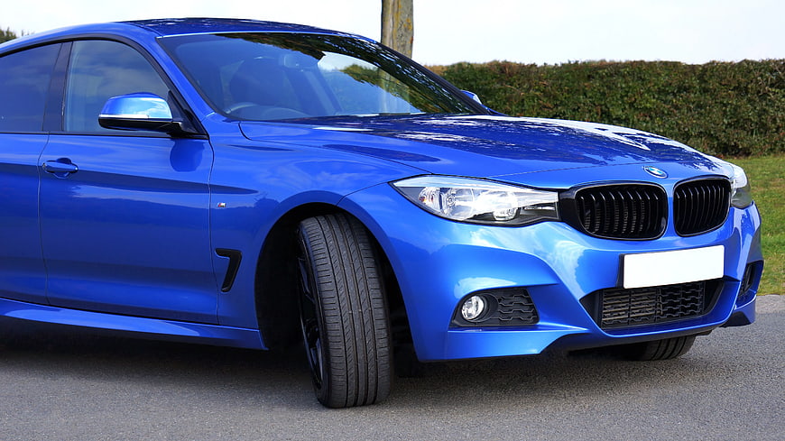 Blue BMW 4 Series Coupe on Asphalt Road