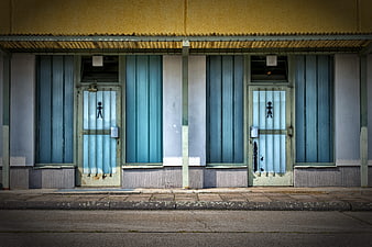 Symmetrical View of Old Public Restroom Doors