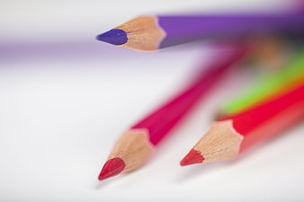 Close-up of colorful pencils on white background