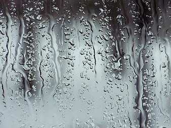 Close-up of Raindrops on a Wet Glass Window Pane