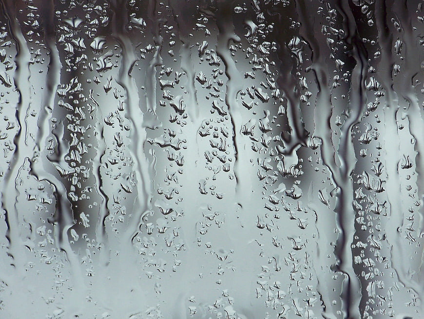 Close-up of Raindrops on a Wet Glass Window Pane